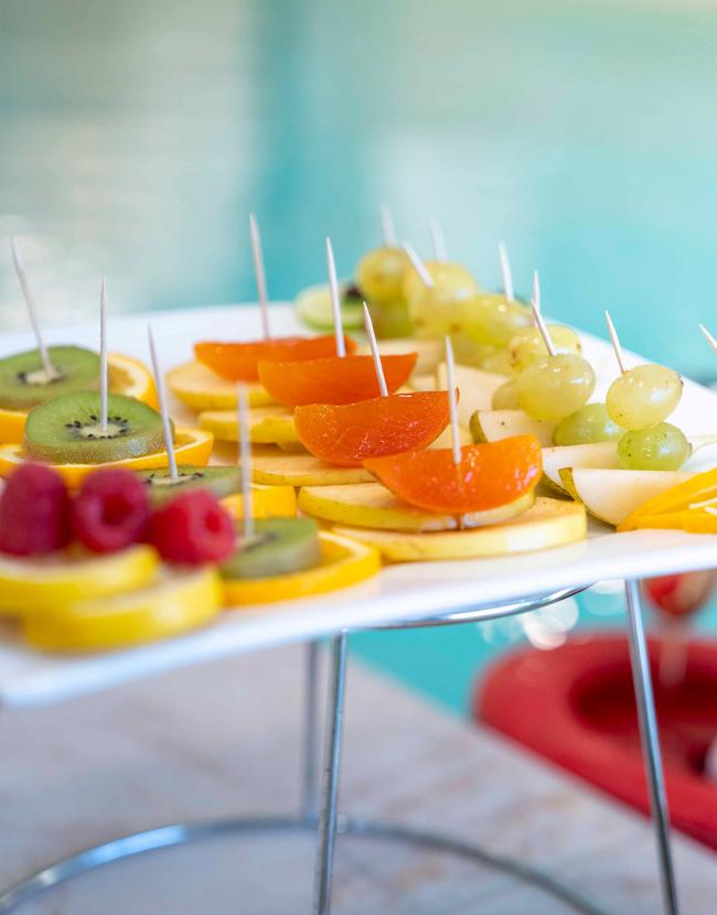 Fresh fruit skewers by the pool.